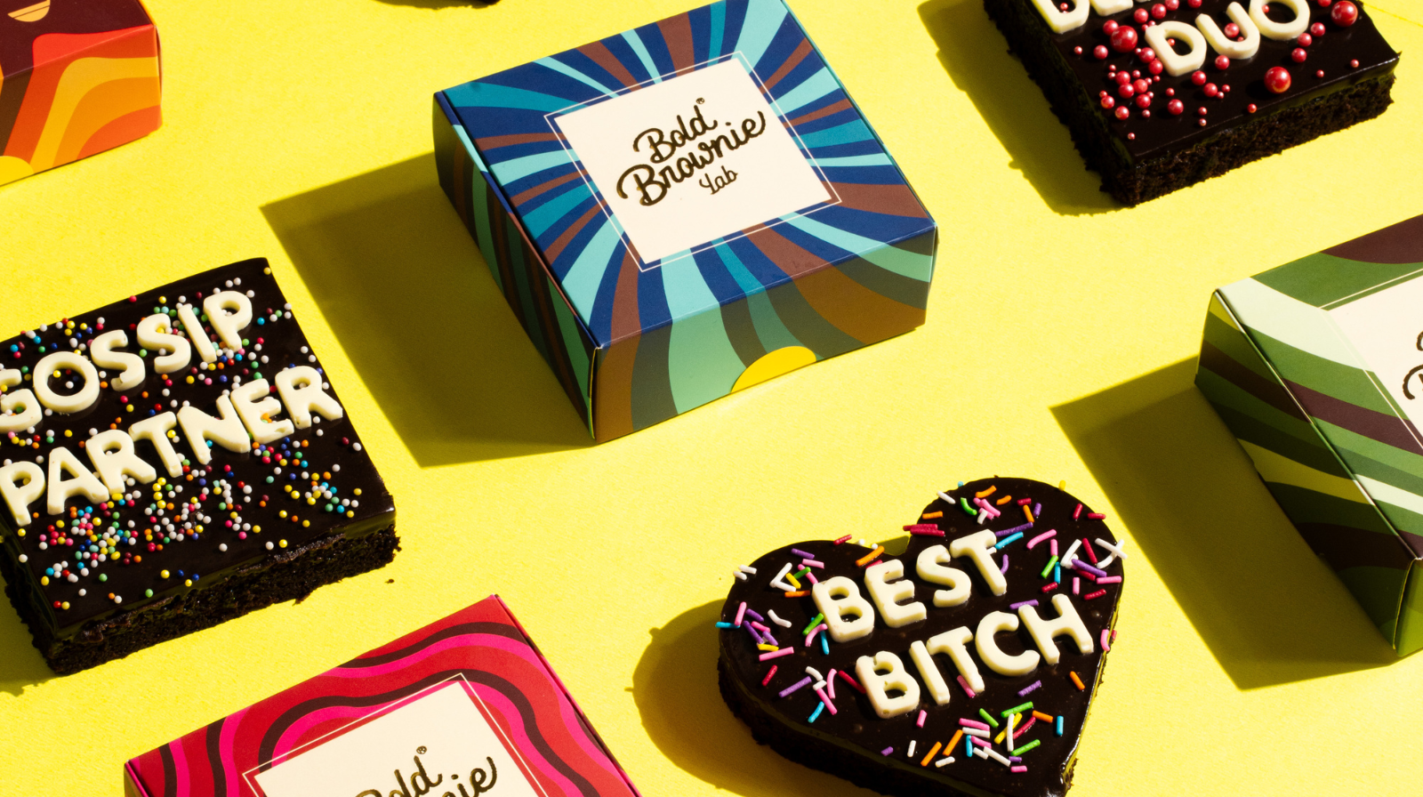 Colorful chocolate bars with text on a yellow background